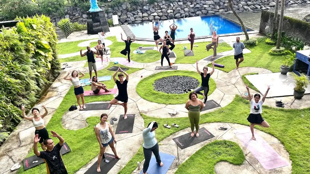 Outdoor yoga class with ocean view at Bali 300 hour campus